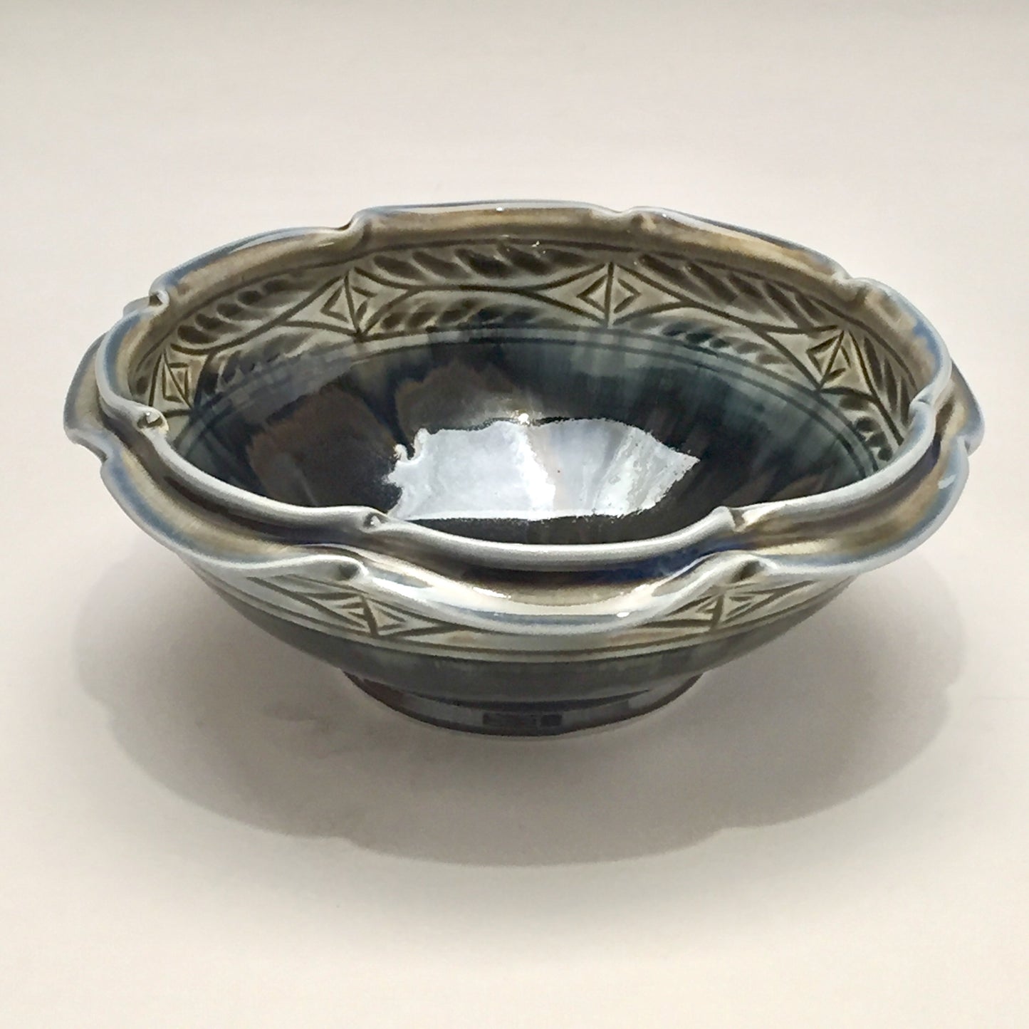 Bowl, Flower - Shiny black, carved, by Kathryne Koop
